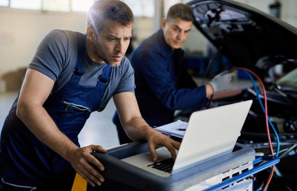Men working on computer